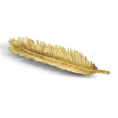The Michael Aram New Leaves Serveware Collection features a gold-colored feather-shaped tray, bringing handcrafted, nature-inspired decor to any space. Shown against a white background.