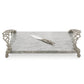 Rectangular marble serving tray with ornate metal handles and feet from the Michael Aram Ocean Reef Serveware and Barware Collection, paired with a matching cheese knife resting on the tray.