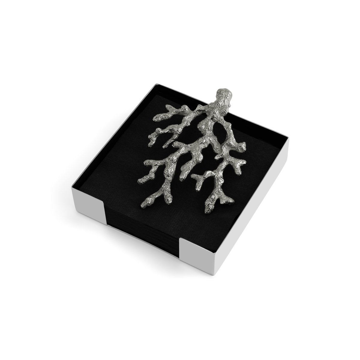 A silver coral branch from the Michael Aram Ocean Reef Serveware and Barware Collection rests atop a black and white box, set against a white background.