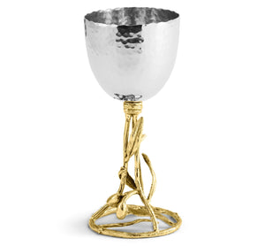 The Olive Branch Kiddush Cup by Michael Aram features a hammered silver finish and gold stem inspired by intertwining branches and leaves—making it a stunning individual gift.