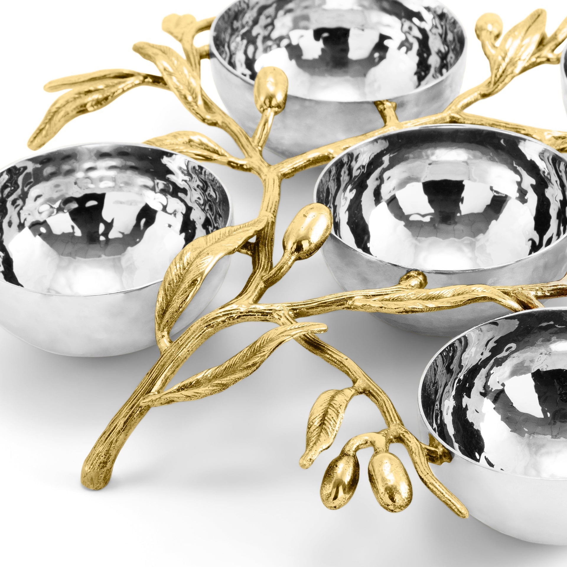 Four silver bowls are joined by a gold-toned, branch-like structure with leaves and buds, echoing the Michael Aram Olive Branch Judaica Collection, and are elegantly displayed on a white surface.