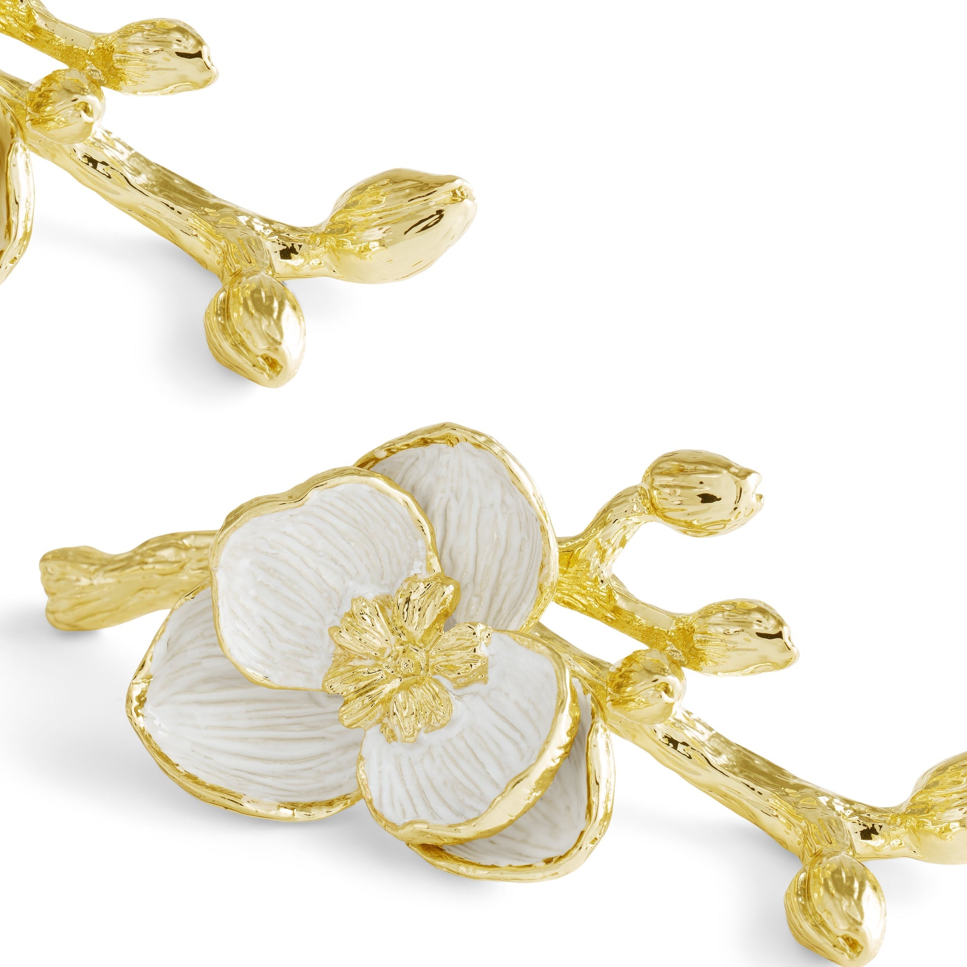 The Michael Aram Orchid Place Card Holder Set features gold and white enamel orchids with multiple petals and buds, ideal as elegant place card holders or luxury table décor.