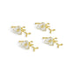 The Michael Aram Orchid Place Card Holder Set features four gold and white flower-shaped holders, elegantly arranged on a white background.