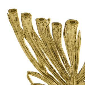 Close-up of the Michael Aram Gold Palm Menorah, Small— a hand-sculpted, gold-colored metal piece with abstract tree branch design and hollow cylindrical tops, inspired by the Palm Collection, set against a white background.