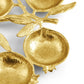 Gold-toned Pomegranate Seder Plate by Michael Aram, designed with pomegranate shapes, leaves, and branches, displayed against a white background—a striking piece from the Michael Aram Pomegranate Collection, ideal for those seeking symbolic home accents.