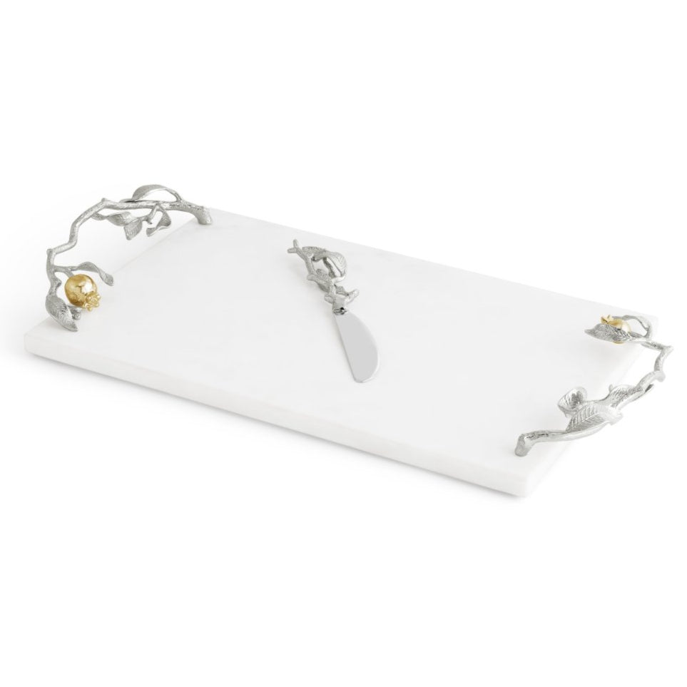Rectangular white marble cheese board from Michael Aram's Pomegranate Silver & Gold Serveware Collection, with silver-tone branch handles featuring animal accents and a matching stainless steel nickelplate cheese knife in the center.