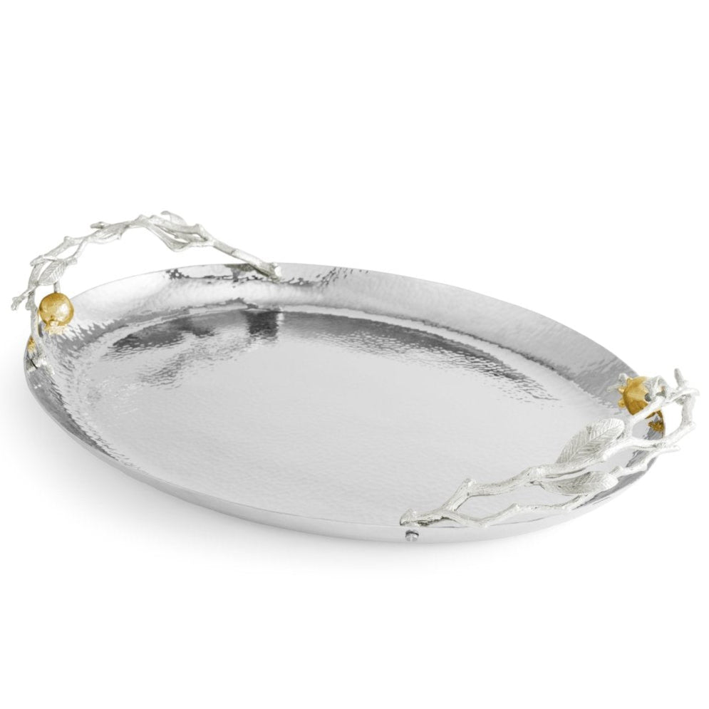 From Michael Aram’s Pomegranate Silver & Gold Serveware Collection, this oval silver serving tray features textured stainless steel, branch-like handles, and goldplate accents for lasting elegance.