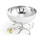 From Michael Aram's Pomegranate Silver & Gold Serveware Collection, this bowl features polished stainless steel and goldplated accents, gracefully resting on a sculpted branch base with delicate leaf details and a gold pomegranate ornament.