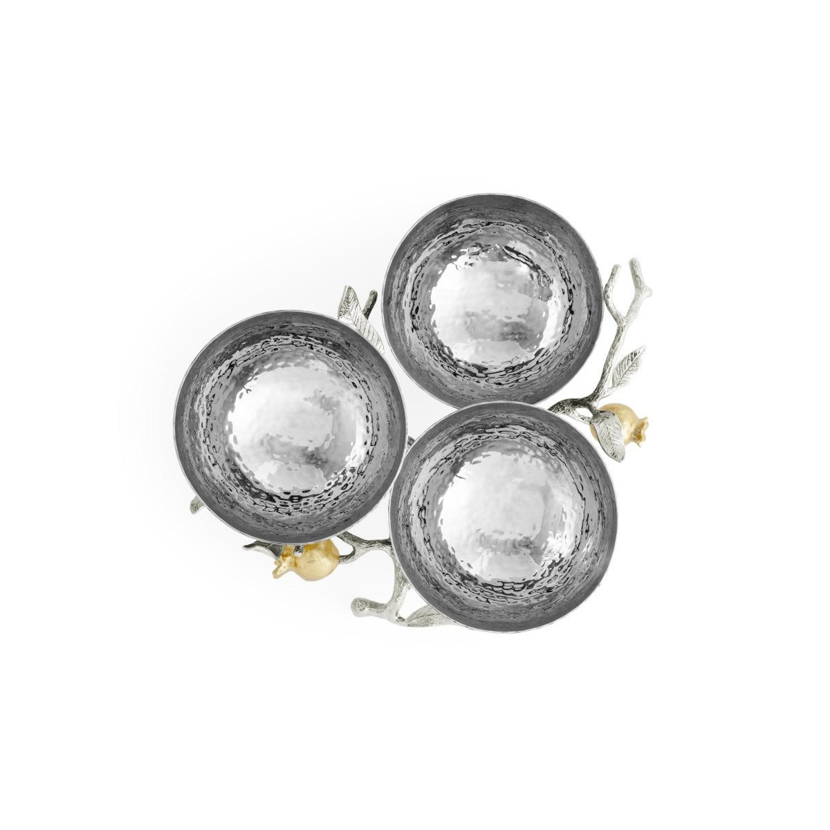 Three silver hammered metal bowls from the Michael Aram Pomegranate Silver & Gold Serveware Collection are joined by decorative branches and yellow flowers, crafted in stainless steel, nickelplate, and goldplate.