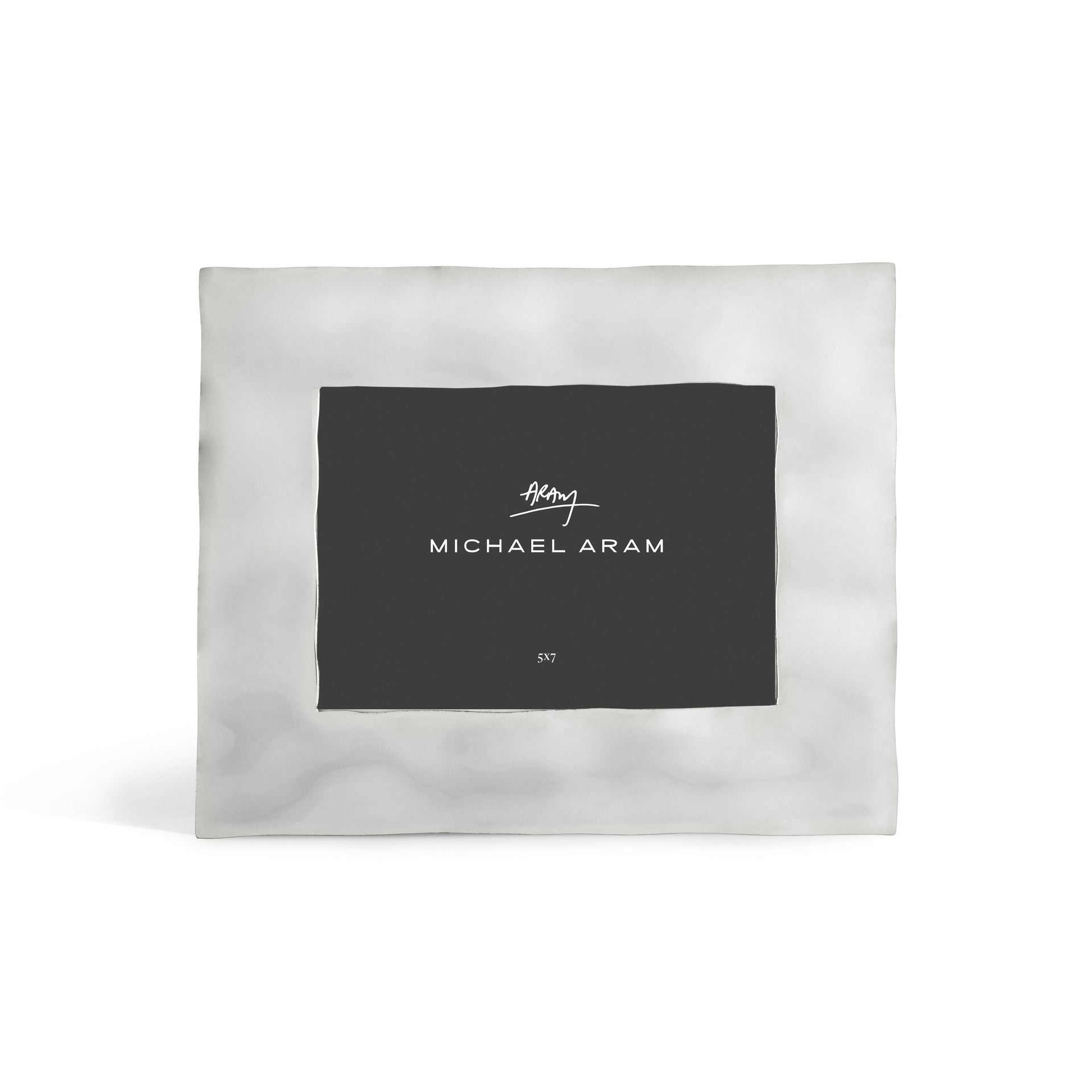 The Reflective Frame Nickel Collection by Michael Aram features a square metallic design with a nickelplate finish, black center insert displaying the brand name in white, all set against a plain white background for a modern look.