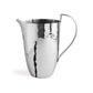 A highly polished stainless steel pitcher with a hammered finish and curved handle from the Michael Aram Reflective Serveware Collection is displayed against a plain white background.