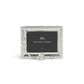 A silver hammered metal photo frame from the Michael Aram White Orchid Frame Collection features floral orchid-inspired accents and includes a "Michael Aram" placeholder card, capturing the purity and elegance of the collection.