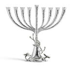 The Michael Aram White Orchid Menorah features a handcrafted nickelplate design with eight branches, a central stem, hammered texture, and elegant floral accents on the base.