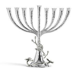 The Michael Aram White Orchid Menorah features a handcrafted nickelplate design with eight branches, a central stem, hammered texture, and elegant floral accents on the base.