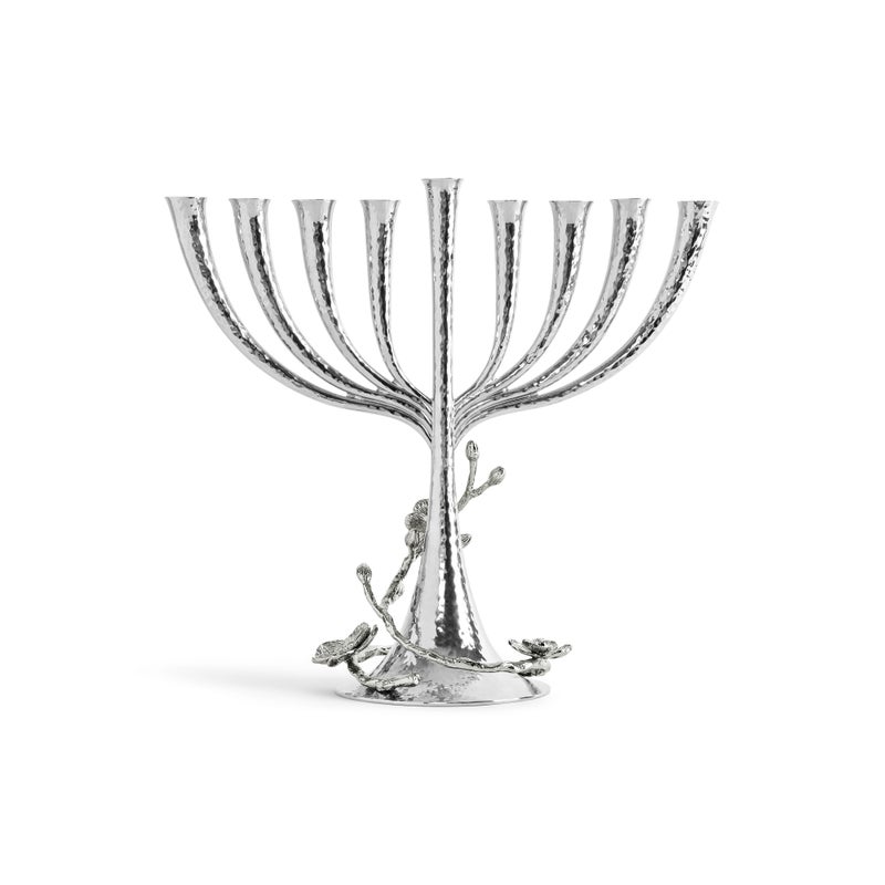 The Michael Aram White Orchid Menorah features a handcrafted nickelplate design with a textured finish, eight branches, and decorative orchid accents at the base.