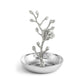 The Michael Aram White Orchid Ring Catchall features a raised, sculpted branch and flower design in the center atop a hammered silver-finished tray. Inspired by Michael Aram’s artistry, this handcrafted catchall is perfect for organizing your favorite rings and accessories.