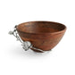 The Michael Aram White Orchid Wood Salad Bowl is a luxurious round wooden bowl adorned with a decorative silver metal branch and orchid flower design on one side, bringing an elegant touch to your table setting.