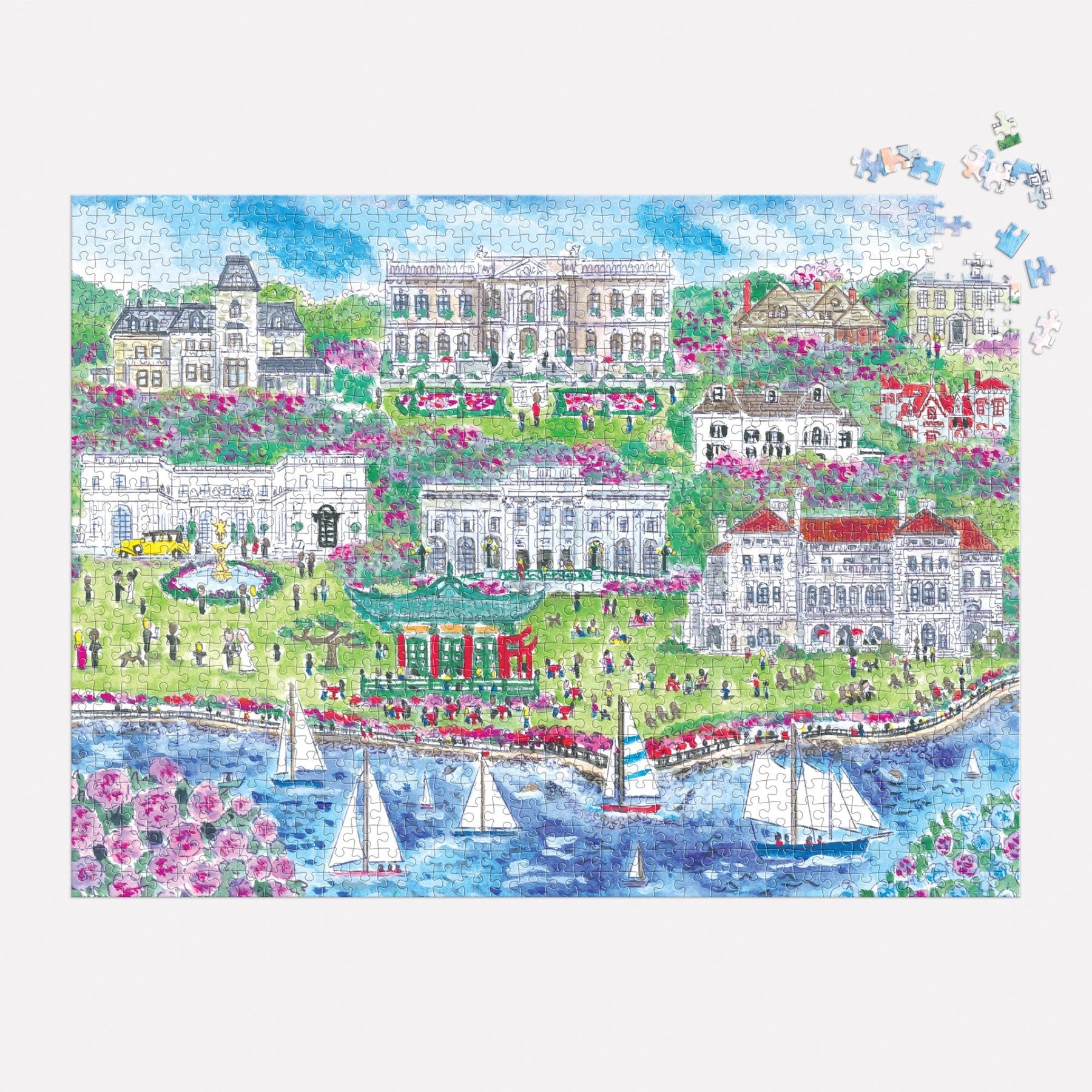 The Michael Storrings Newport Mansions 1,000 Piece Puzzle by Chronicle Books presents a stunning coastal scene featuring sailboats gracefully passing by, expansive green lawns, and magnificent buildings that evoke the grandeur of the Gilded Age Newport Mansions.