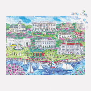 The Michael Storrings Newport Mansions 1,000 Piece Puzzle by Chronicle Books presents a stunning coastal scene featuring sailboats gracefully passing by, expansive green lawns, and magnificent buildings that evoke the grandeur of the Gilded Age Newport Mansions.