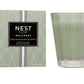 The Nest Wild Mint & Eucalyptus Candle Collection features green glass candles in minimalist packaging, offering a refreshing fragrance blend of wild mint and eucalyptus.