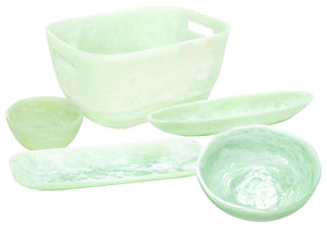 The Mint Resin Serveware Collection by Nashi Home features five light green, translucent serving bowls and trays in assorted shapes and sizes—durable, shatter-resistant accents for your home decor. Shown on a white background.