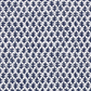 The Burma White Indigo Outdoor Lumbar Pillow from Associated Design features quality white fabric with dark blue leaf patterns in neat rows—ideal for adding a timeless touch to your outdoor decor.