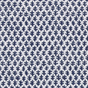 The Burma White Indigo Outdoor Lumbar Pillow from Associated Design features quality white fabric with dark blue leaf patterns in neat rows—ideal for adding a timeless touch to your outdoor decor.