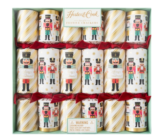 A boxed set of six Hester & Cook Nutcracker Collection Christmas crackers, each decorated with a nutcracker illustration and gold diagonal stripes.