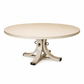 Introducing the Artisan Round Dining Table by Hickory Chair—a beautifully crafted dining piece made from light-toned wood, showcasing a smooth tabletop and a sturdy sculptural pedestal base with four elegantly curved legs accented by striking metal rings.