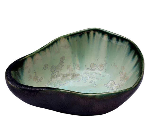 The AE Ceramics Large Sauce Bowl Collection features asymmetrical ceramic bowls with a dark exterior and glossy light green mottled interior—an elegant, handmade addition to your ceramics collection.