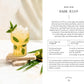 A glass of Monday Night Mocktails by Simon & Schuster, garnished with ice, fresh basil leaves, and a lime wedge, sits on a white surface; scattered basil and lime nearby make it an appealing and refreshing option for those interested in non-alcoholic drinks or innovative mocktail recipes.