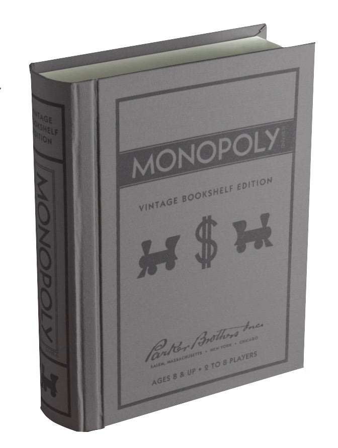A gray book-shaped box adorned with the title "Monopoly Vintage Bookshelf Edition" on both the cover and spine, this WS Game Company product is designed to resemble a classic hardcover. Suitable for ages 8 and up, it accommodates 2-8 players.