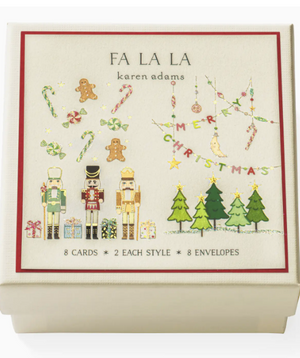 Box of Fa La La Gift Enclosures by Karen Adams, featuring hand-glittered nutcrackers, trees, candy canes, ornaments, and a "Merry Christmas" banner. Includes 8 cards and 8 envelopes.