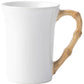 A white ceramic mug from Juliska’s Classic Bamboo Dinnerware Collection featuring a bamboo-inspired handle for casual elegance and global flair at your table.