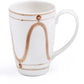 White ceramic mug from Themis Z's Serenity Beige Dinnerware Collection, featuring a hand-painted curved brown line and dot pattern around the exterior, displayed on a white background.