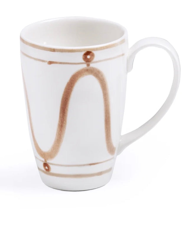 White ceramic mug from Themis Z's Serenity Beige Dinnerware Collection, featuring a hand-painted curved brown line and dot pattern around the exterior, displayed on a white background.