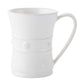 A white ceramic mug from Juliska’s Berry & Thread Classic Whitewash Dinnerware Collection features a flared rim, rope-like band, and ornate handle, displayed on a plain white background.