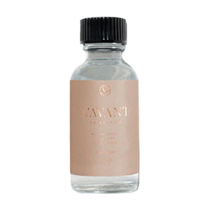 A small clear eco-luxe glass bottle with a black cap and beige label reading “L’Avant Collective” on a white background—perfect for their Blushed Bergamot Multipurpose Concentrate Refill.