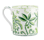 The Cobblers Cove Calypso Dinnerware Collection by Royal Crown Derby features a white ceramic mug adorned with green botanical and jungle motifs, bringing a lively Caribbean feel to your vibrant green dinnerware ensemble.