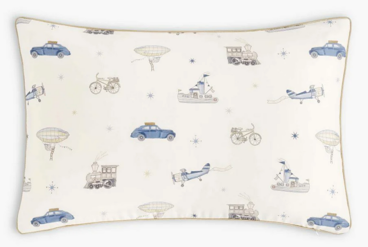 Introduce your child to the Transit Treasures Bedding Collection by Gooselings—a rectangular white pillowcase adorned with blue and beige illustrations of cars, airplanes, trains, boats, bicycles, hot air balloons, and delicate stars in a charming repeating pattern. Made from breathable, pure materials and OEKO-TEX certified for both safety and comfort.