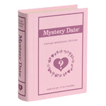 A pink, fabric-wrapped book-shaped box from the Vintage Bookshelf Board Games by WS Game Company, for 2–4 players ages 8+, features heart and question mark graphics; part of the Vintage Bookshelf Collection.