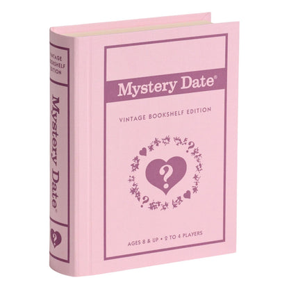 A pink, fabric-wrapped book-shaped box from the Vintage Bookshelf Board Games by WS Game Company, for 2–4 players ages 8+, features heart and question mark graphics; part of the Vintage Bookshelf Collection.
