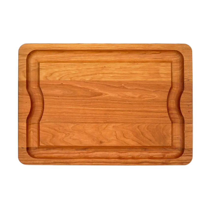 The J.K. Adams Cherry BBQ Board features a recessed juice groove around the edge and two curved side indentations for easy handling.