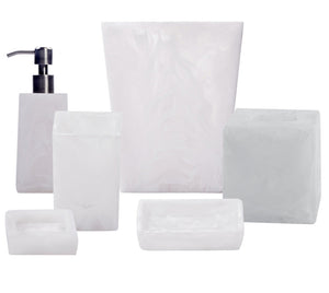 The Swirl White Resin Bath Collection by Nashi Home features six durable accessories—a soap dispenser, tumbler, toothbrush holder, waste bin, soap dish, and tissue box cover—displayed against a white background.