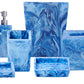 The Denim Resin Bath Collection by Nashi Home features blue and white marbled bathroom accessories inspired by Sydney beaches, including a soap dispenser, toothbrush holder, tissue box, waste bin, soap dish, and tray.