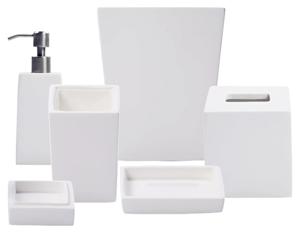 The Nashi Home Bath Collection in Solid White includes a sleek soap dispenser, toothbrush holder, tissue box cover, soap dish, and tray—beautifully showcased against a crisp white background.