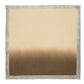 A beige square cloth with an autumn-inspired dark brown ombre fade and elegantly bordered metallic silver edges mimics the charm of Kim Seybert's Dip Dye Napkin Set.