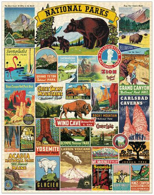 The Cavallini Papers and Co National Parks Map 1,000 Piece Puzzle features a vibrant collage of vintage-style U.S. national parks posters and signs, with colorful illustrations and bold park names like Yellowstone and Yosemite.