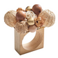The Kim Seybert Java Napkin Ring features a rectangular wooden base with decorative rattan accents and natural-hued wooden beads for added texture.