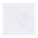 The Nautilus Shell Coaster Set by Haute Home features white linen coasters embroidered with a nautilus shell design, ideal for bringing coastal elegance to your table setting.